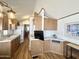 Functional kitchen with wood cabinets, white countertops, and essential appliances at 457 S Jaspar Dr, Apache Junction, AZ 85119