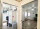 Laundry room with washer, dryer and adjacent living room at 457 S Jaspar Dr, Apache Junction, AZ 85119