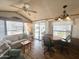 Bright living room featuring comfortable seating, wood-look flooring, and a ceiling fan at 457 S Jaspar Dr, Apache Junction, AZ 85119