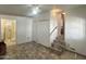 Living room area with access to the bathroom, tile floors, and a storage closet at 457 S Jaspar Dr, Apache Junction, AZ 85119