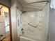Corner shower with white marble-patterned surround and safety bar at 457 S Jaspar Dr, Apache Junction, AZ 85119