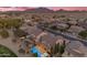 Community aerial view showcasing backyard pools and open spaces surrounded by mountain views at 4630 E Hazeltine Way, Chandler, AZ 85249