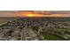 Expansive aerial view showcasing a large residential community with neighborhood parks at sunset at 4630 E Hazeltine Way, Chandler, AZ 85249