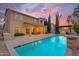 Stunning backyard pool with covered patio seating area with a fire pit and an outdoor bar at 4630 E Hazeltine Way, Chandler, AZ 85249