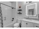 Clean bathroom with a shower and tub combo, sleek fixtures, and a modern vanity mirror at 4630 E Hazeltine Way, Chandler, AZ 85249