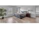 Serene bedroom with a comfortable bed, large windows, and a calming color scheme at 4630 E Hazeltine Way, Chandler, AZ 85249