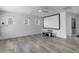Bonus room with a large screen projector setup and transom windows for ample light at 4630 E Hazeltine Way, Chandler, AZ 85249