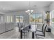 Dining area featuring a modern table with seating and a view of the backyard pool at 4630 E Hazeltine Way, Chandler, AZ 85249