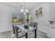 Bright dining area with modern table and chairs, overlooking the pool and backyard at 4630 E Hazeltine Way, Chandler, AZ 85249