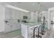 Bright kitchen with white cabinetry, quartz countertops, stainless steel appliances and pendant lighting at 4630 E Hazeltine Way, Chandler, AZ 85249