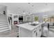 Modern kitchen island with a sink and a view of the living room and outdoor pool area at 4630 E Hazeltine Way, Chandler, AZ 85249