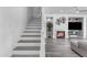 Cozy living area with a fireplace, stylish decor, and staircase at 4630 E Hazeltine Way, Chandler, AZ 85249