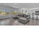 Open-concept living area featuring a comfortable sectional sofa and views of the pool at 4630 E Hazeltine Way, Chandler, AZ 85249