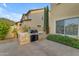 Built-in outdoor grill on a stone base and a paved patio, perfect for outdoor cooking and entertaining at 4630 E Hazeltine Way, Chandler, AZ 85249