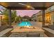 Inviting outdoor living space with a fire pit and comfortable seating, providing the perfect spot to relax by the pool at 4630 E Hazeltine Way, Chandler, AZ 85249