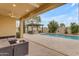 Relaxing patio with covered seating area, complete with a pool and comfortable outdoor furniture, perfect for entertaining at 4630 E Hazeltine Way, Chandler, AZ 85249