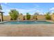 Backyard featuring a beautiful pool with elegant water features, complemented by a spacious patio area, ideal for relaxation at 4630 E Hazeltine Way, Chandler, AZ 85249