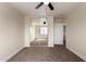 Bedroom featuring neutral walls, carpet flooring and a mirrored closet, complete with a doorway at 4659 E Pinto Valley Rd, San Tan Valley, AZ 85143