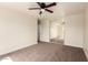 Bedroom showcasing neutral walls, carpet flooring and a mirrored closet, complete with a doorway at 4659 E Pinto Valley Rd, San Tan Valley, AZ 85143