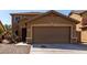 Charming home featuring a two-car garage and landscaped front yard at 4659 E Pinto Valley Rd, San Tan Valley, AZ 85143