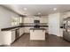 Spacious kitchen with white cabinets, stainless steel appliances, and tile flooring at 4659 E Pinto Valley Rd, San Tan Valley, AZ 85143