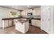 Well-lit kitchen with granite countertops and a center island with tile floor at 4659 E Pinto Valley Rd, San Tan Valley, AZ 85143