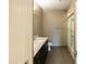 Neutral bathroom features a sleek vanity, shower-tub combo, and gray tile flooring at 4803 N Woodmere Fairway -- # 1003, Scottsdale, AZ 85251