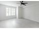 A bright, spacious room with tiled floors and a modern ceiling fan, ready for personalization at 4803 N Woodmere Fairway -- # 1003, Scottsdale, AZ 85251