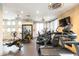 Community gym featuring cardio machines, free weights, and decorative ceiling fans at 4803 N Woodmere Fairway -- # 1003, Scottsdale, AZ 85251