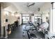 Community gym with weightlifting machines, free weights, and a mirrored wall at 4803 N Woodmere Fairway -- # 1003, Scottsdale, AZ 85251