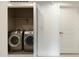 Convenient laundry area featuring modern washer and dryer, neatly tucked away for efficient home management at 4803 N Woodmere Fairway -- # 1003, Scottsdale, AZ 85251