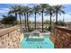 Aerial view of the community pool featuring palm trees, seating area, and spa at The Sage community at 4803 N Woodmere Fairway -- # 1003, Scottsdale, AZ 85251