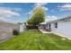 Spacious backyard with dining set, grassy area, and gravel accents at 4907 E Piccadilly Rd, Phoenix, AZ 85018