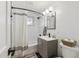 Bathroom featuring a shower and tub combination, a vanity and sink, a mirror, and a toilet at 4907 E Piccadilly Rd, Phoenix, AZ 85018