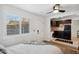 Open bedroom view with a window, ceiling fan, and partial view of the kitchenette at 4907 E Piccadilly Rd, Phoenix, AZ 85018