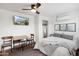 Bright bedroom featuring a TV, ceiling fan, closet, and stylish decor at 4907 E Piccadilly Rd, Phoenix, AZ 85018