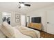 Comfortable bedroom showcasing a closet and light wood-style cabinet with large mirror at 4907 E Piccadilly Rd, Phoenix, AZ 85018