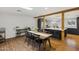 Dining room with wood floors leads to a kitchen with island and stainless steel appliances at 4907 E Piccadilly Rd, Phoenix, AZ 85018