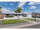 Charming single-story home features a manicured front yard and a lovely, light blue painted facade at 4907 E Piccadilly Rd, Phoenix, AZ 85018