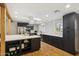 Spacious kitchen features an island, stainless steel appliances, and updated cabinetry and countertops at 4907 E Piccadilly Rd, Phoenix, AZ 85018