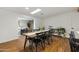 Cozy living room with wood floors and a large window for ample natural light at 4907 E Piccadilly Rd, Phoenix, AZ 85018