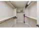 Walk-in closet offering ample storage with shelves, wooden rods, and neutral wall paint at 4932 S Verbena Ave, Gilbert, AZ 85298