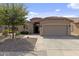 Charming single-story home featuring a two-car garage, desert landscaping, and a beautiful red tile roof at 4932 S Verbena Ave, Gilbert, AZ 85298