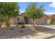 Charming home featuring low maintenance desert landscaping and a two-car garage at 4932 S Verbena Ave, Gilbert, AZ 85298
