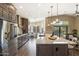 Modern open concept kitchen featuring an island, pendant lights, stainless steel appliances at 4932 S Verbena Ave, Gilbert, AZ 85298
