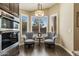 Cozy sitting area by the kitchen with plantation shutters and outside views at 4932 S Verbena Ave, Gilbert, AZ 85298