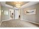 Inviting bedroom with a chandelier, neutral tones, and an ensuite bathroom at 5250 E Deer Valley Dr # 206, Phoenix, AZ 85054