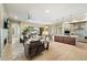 Spacious living room with views of the patio, seamlessly connected to the kitchen and dining area at 5250 E Deer Valley Dr # 206, Phoenix, AZ 85054