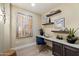 Functional home office with custom built-ins, stylish decor, and plenty of natural light at 5250 E Deer Valley Dr # 206, Phoenix, AZ 85054