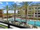 Resort-style pool area with palm trees, lounge chairs, and poolside amenities at 5250 E Deer Valley Dr # 206, Phoenix, AZ 85054